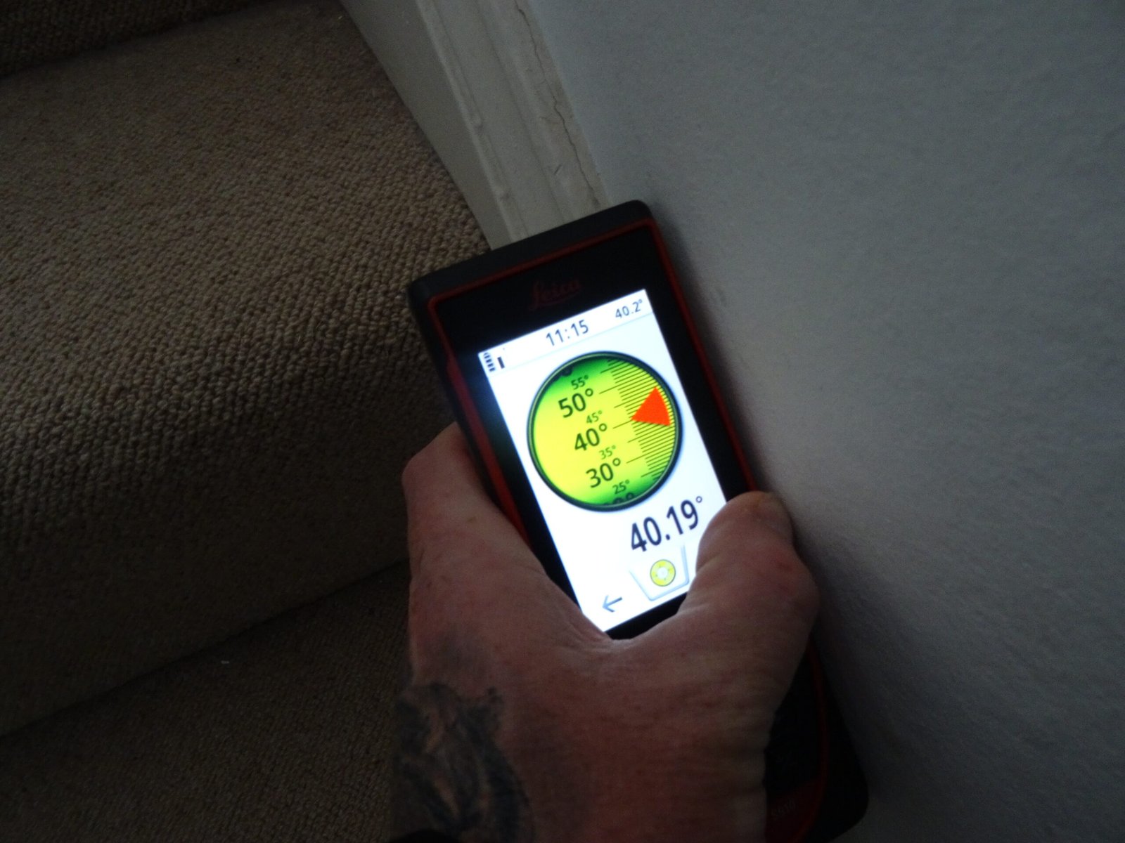 Visible cracking and moisture staining inspected during a residential building survey